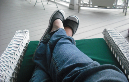 Feet up on a wicker chair overlooking the ocean. Yup, my part time gig is hard.