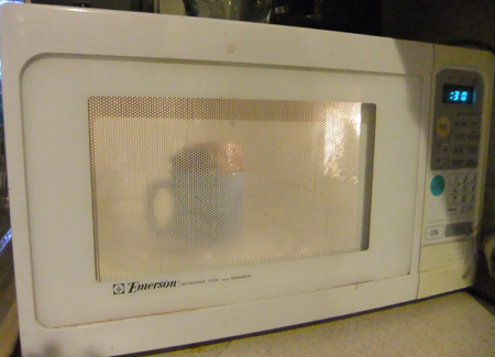 The cake will rise over the top of the cup. Don't be alarmed. OK, directions. Besides, it's Sue's microwave anyway!