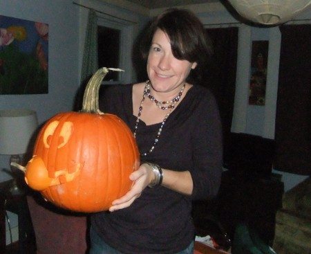 Jen and her carvniverous pumpkin.